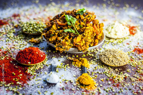 Close up of Indian/Asian popular Ramzan's/Ramadan's special vada/vadiya with all its grams,speices on a wooden surface in dark Gothic colors. photo