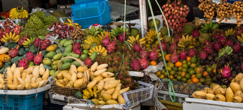Colorful panoramic shot of exotic fruit display at a local market in Asia