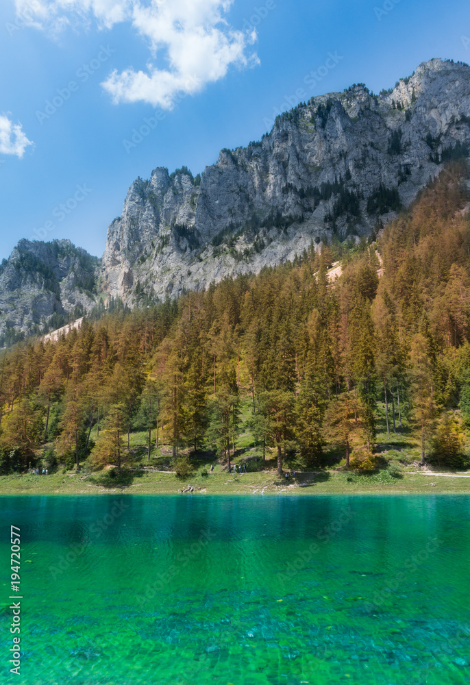 The beautiful Gruenersee lake in Austria with its turquoise waters and fall colored forests adorning the mountain slops