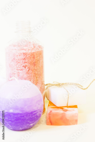 Aromatherapy spa concept. Pink and blue sea salt  blue candle  closeup