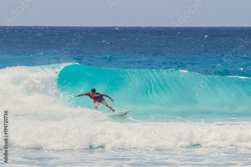 A Surfer Rides a Wave in Barbados, Blue Surf, Caribbean Sea