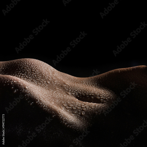 Bodyscape of a Nude wet belly