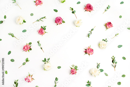 Floral frame wreath of rose flowers and eucalyptus branches on white background. Flat lay, top view flowers mockup.