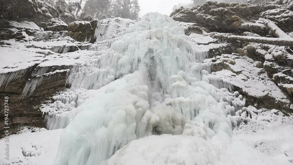 Frozen famous Giessbach waterfall in the Bernese Oberland in the Alps of Switzerland Frozen famous Giessbach waterfall in the Bernese Oberland in the Alps of Switzerland