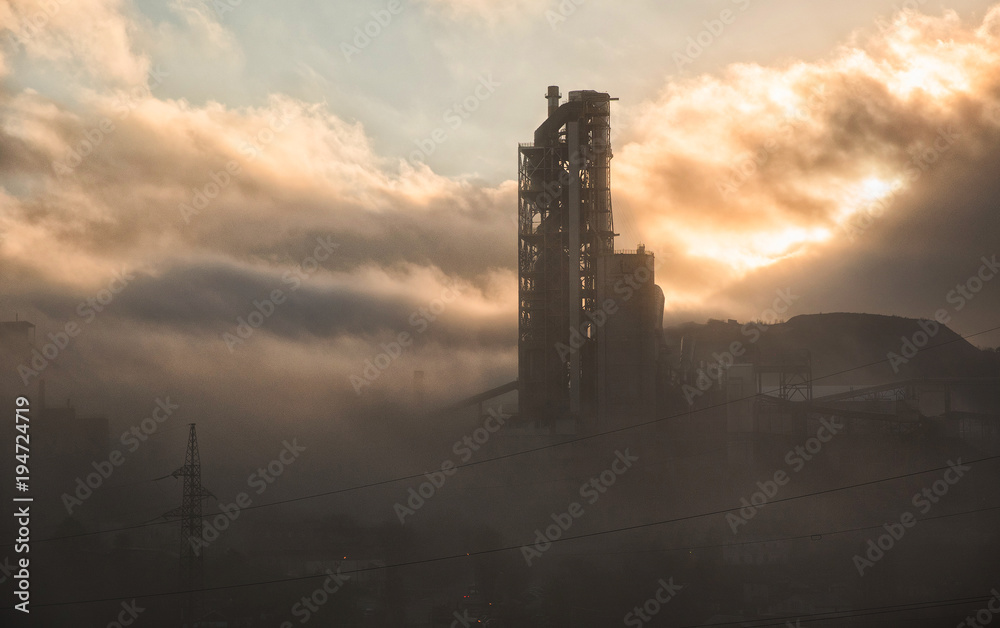 cement plant in fog in the morning