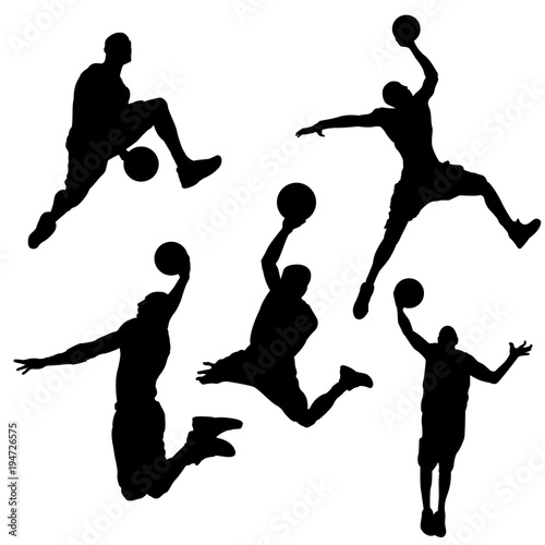 Black silhouettes of a basketball player on a white background photo