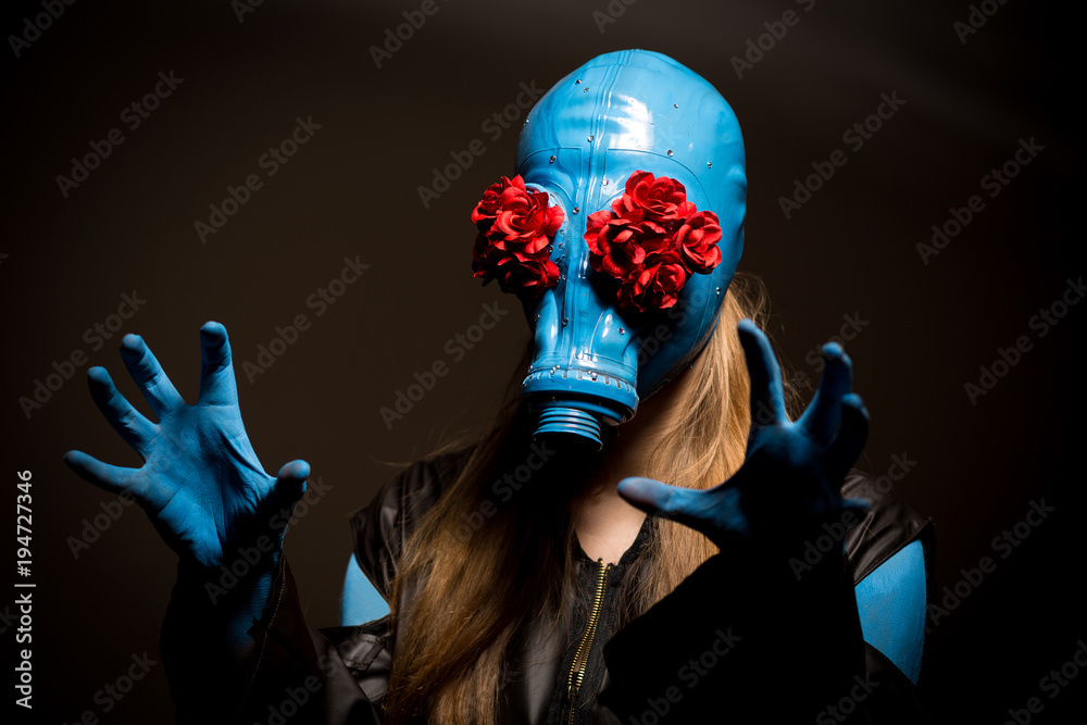 Creepy girl with blue skin and in a gas mask Stock Photo | Adobe Stock