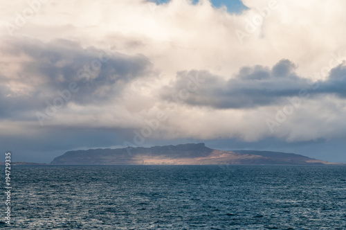 Eigg / The sunlit Isle of Eigg, one of the Small Isles, taken from Ardnamurchan, Lochaber,Scotland. 01 January 2018
