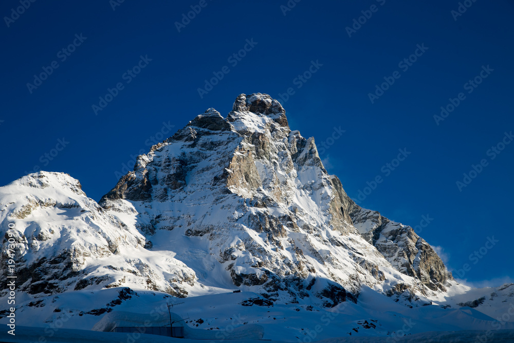 Monte Cervinia on blue sky background