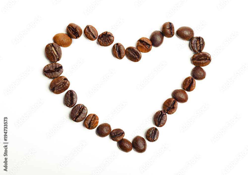 Coffee beans in shape of heart isolated on a white background Coffee beans in shape of heart isolated on a white background