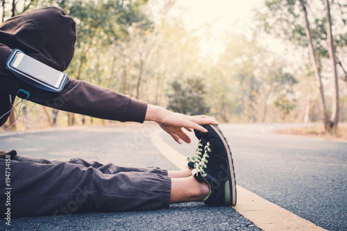 Man warm up before running on the road for health  color of hipster tone selective and soft focus