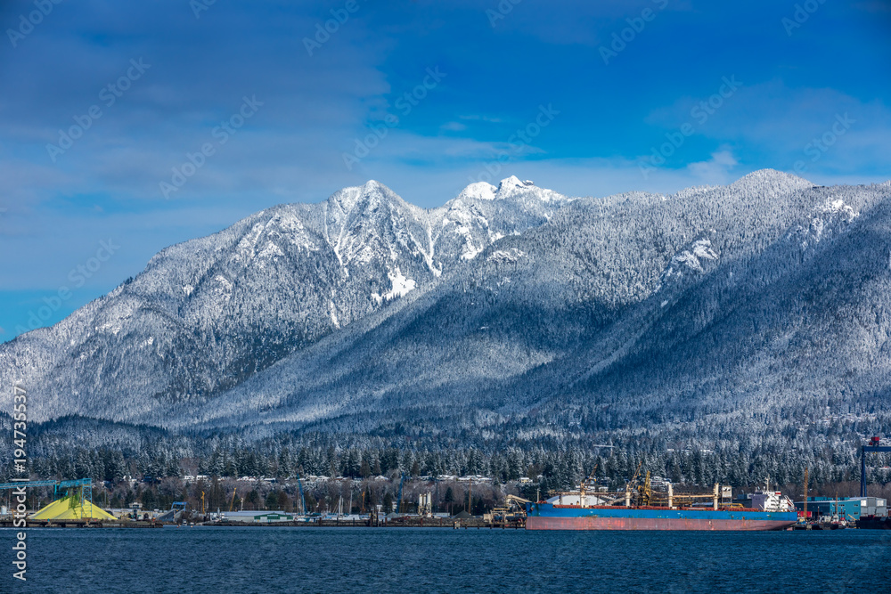 Tanker and Rocky Mountains, Vancouver, British Colombia, Canada.