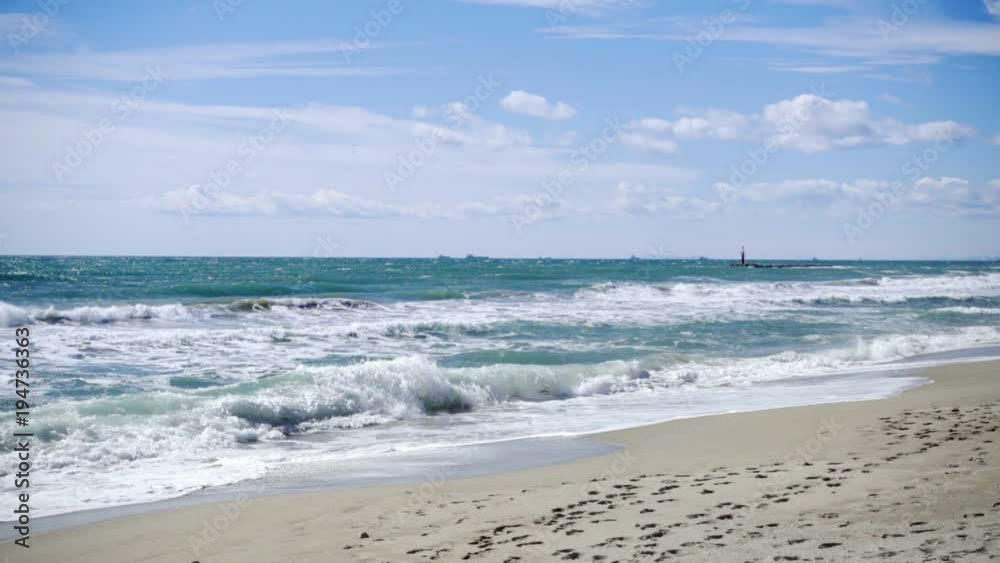 Slow motion 120fps shoot of sea waves breaking on a sandy beach. Mediterranena sea waves in Altafulla, Spain. Slow motion 120fps shoot of sea waves breaking on a sandy beach. Mediterranena sea waves in Altafulla, Spain.