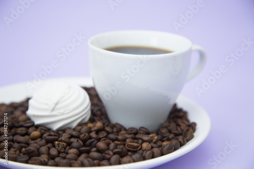 Coffee with sweets on light purple background