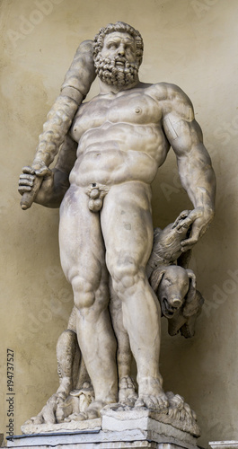 Statue of Hercules with a three headed dog at entrance of the Ducal Palace in Modena, Italy