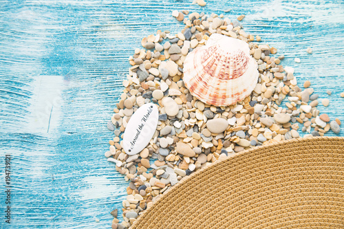 Vacation concept. Seashells on blue wooden background, copy space photo