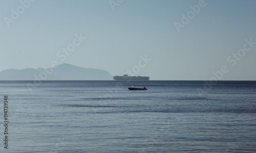 Egypt panoramic view os Red sea and Tiran island taken from Sharks Bay in Sharm el Sheikh with blue sky and water at summer evening
