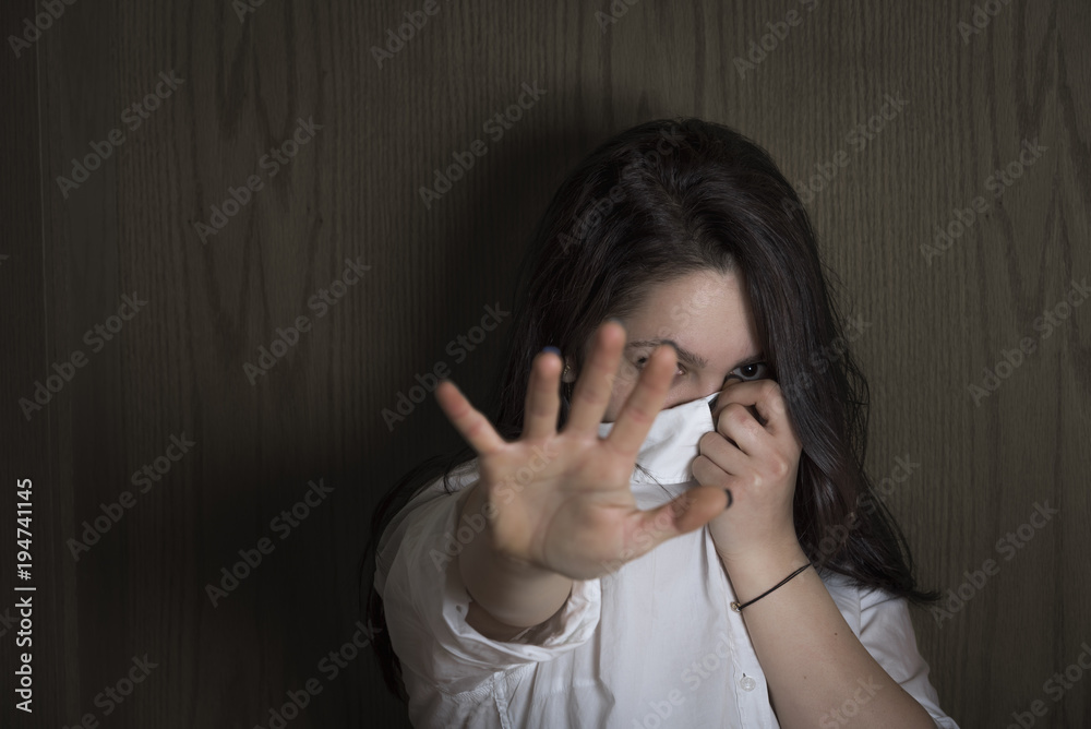 Woman hiding her face Woman hiding her face