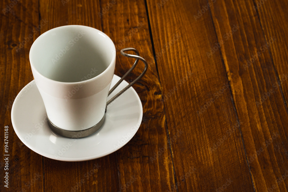 Empty coffee cup on wooden table Empty coffee cup on wooden table