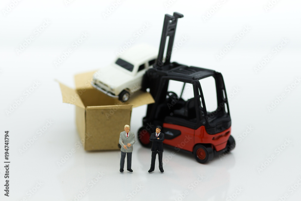 Miniature people : Man of auto insurance when an accident on the road. Image use for Make an agreement, responsibility, business concept. Miniature people : Man of auto insurance when an accident on the road. Image use for Make an agreement, responsibility, business concept.