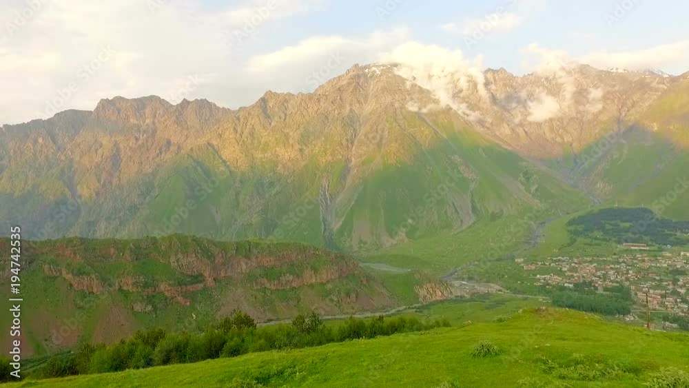 Beautiful red-haired bride and groom against the background of the mountains . Georgia. Kazbegi. Beautiful red-haired bride and groom against the background of the mountains . Georgia. Kazbegi.