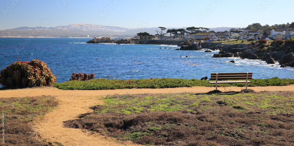 Peaceful waterfront setting at park along Pacific Ocean in Monterey, California