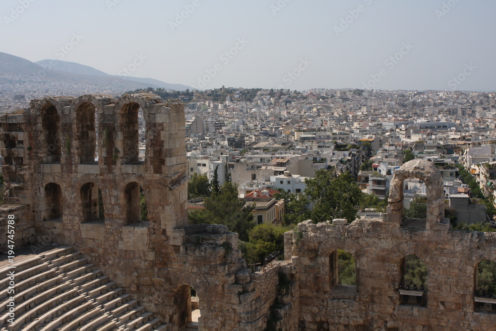 Ancient Odeon of Herodes Atticus in Athens, Greece on Acropolis hill with view over the city.