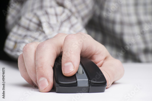 computer mouse in man's hand