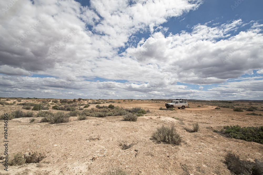South Australia – Outback desert with 4WD track under cloudy sky as panorama - vintage South Australia – Outback desert with 4WD track under cloudy sky as panorama - vintage