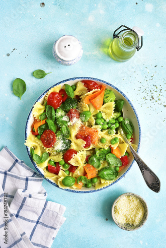 Pasta primavera with spring vegetables.Top view. photo