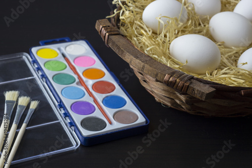 Eggs in a basket and a paintbox