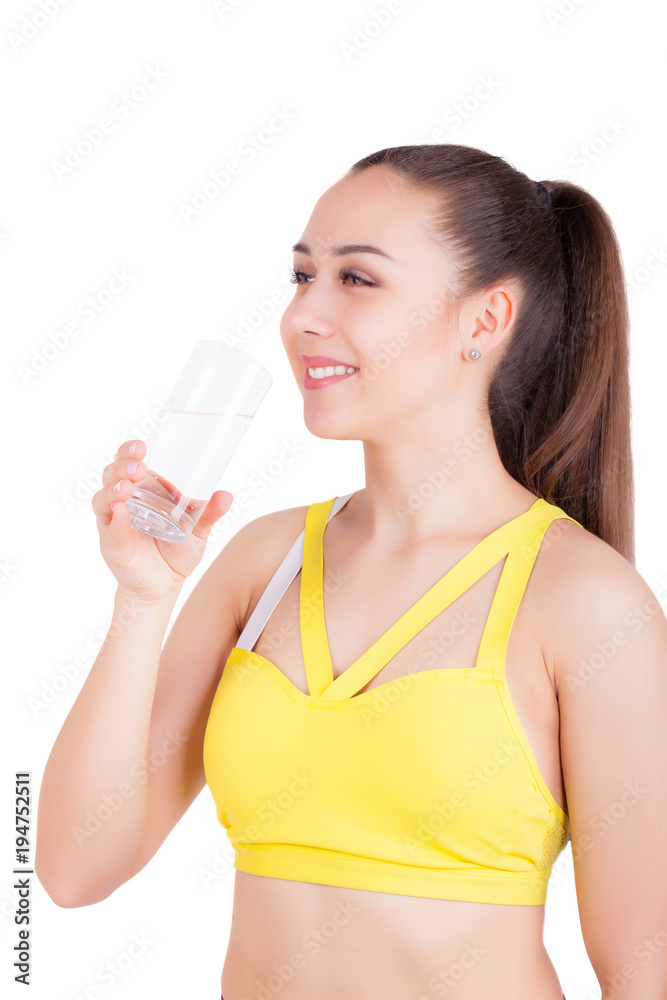 Happy and fit woman drinks water from glass, isolated Happy and fit woman drinks water from glass, isolated