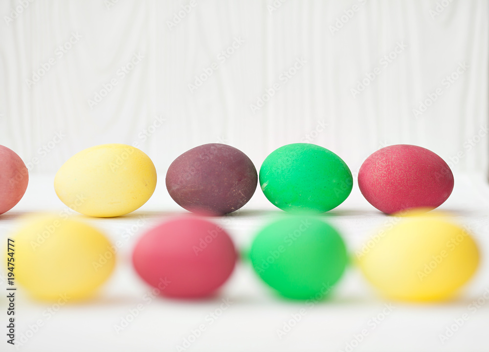 Colorful Easter eggs on white wooden background. Colorful Easter eggs on white wooden background.