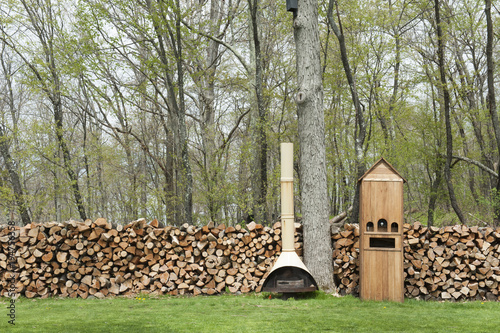 Stack of firewood with stove photo