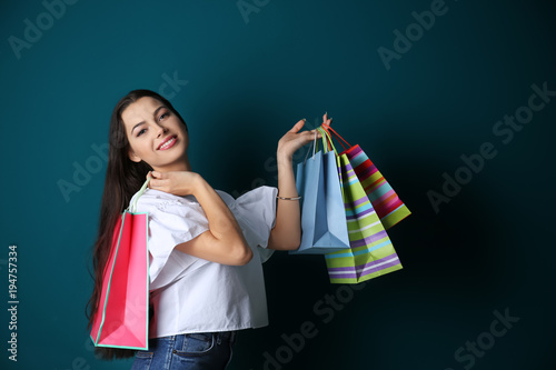 Happy young woman with shop...
