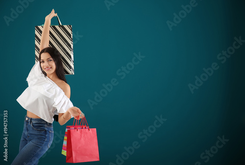 Happy young woman with shop...