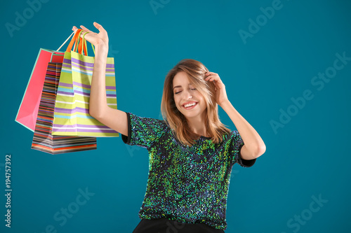 Happy young woman with shop...