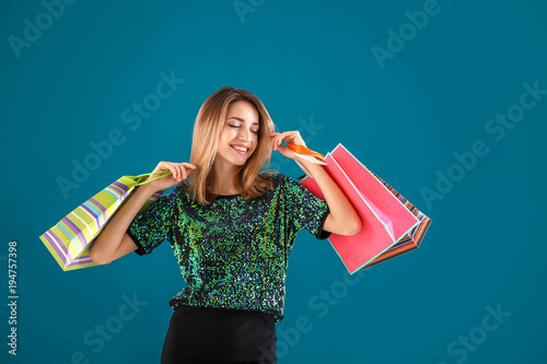 Happy young woman with shop...