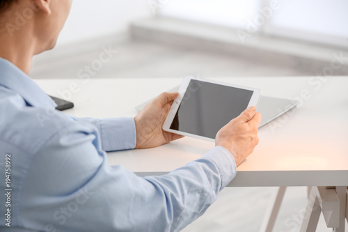 Young man using tablet comp...