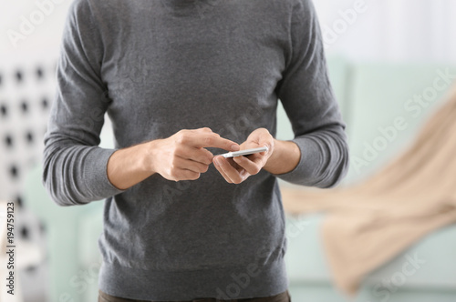 Man using phone at home