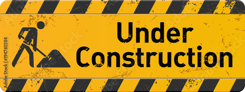 gelbes Schild under construction mit Bauarbeiter-Icon