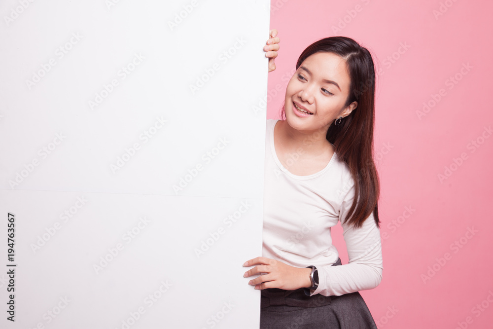 Young Asian woman with blank sign. Young Asian woman with blank sign.