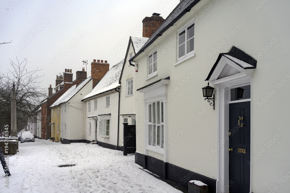Snowy winter street scene at Odiham in Hampshire, UK