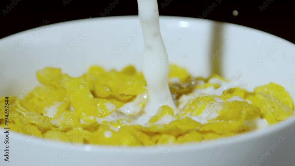 Milk pouring into bowl with corn flakes, Ultra Slow Motion Milk pouring into bowl with corn flakes, Ultra Slow Motion