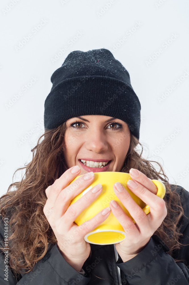 Beautiful girl outdoor, in cold snowy winter drinking hot beverage Beautiful girl outdoor, in cold snowy winter drinking hot beverage