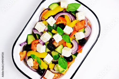 Fresh Greek Salad on the white background. Top view salad. Salad isolated