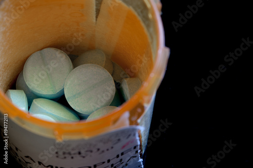 A bottle of prescription pills with copy space