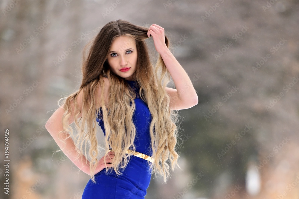 Naklejka premium Snow queen. Woman in winter background.