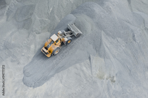 aerial image of a front loader at work on gravel at the Lessines Porphyry mine photo