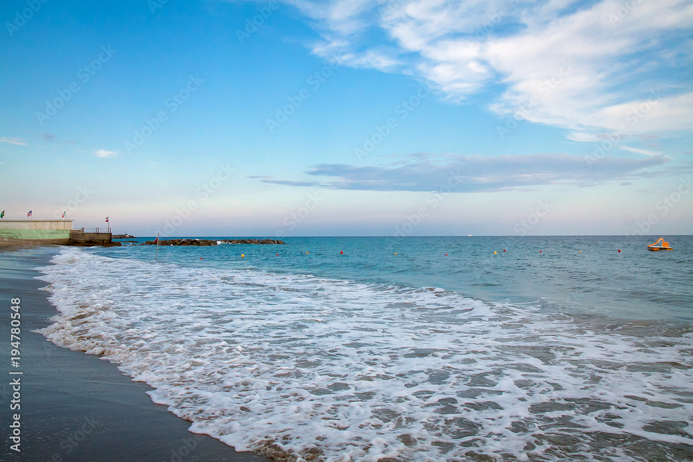 Fototapeta premium Beautiful seascape with a sandy beach and small waves